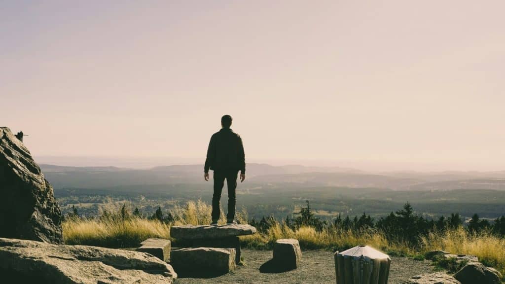 A man on top of a mountain