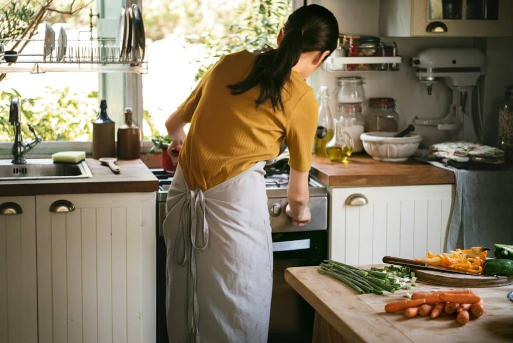 A woman cooking alone.