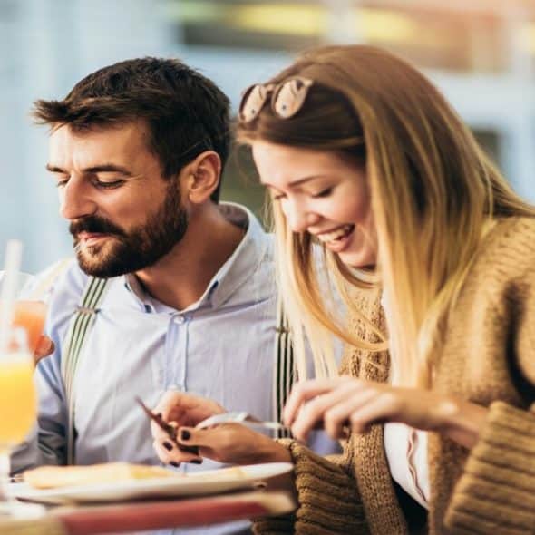 A couple having pizza together