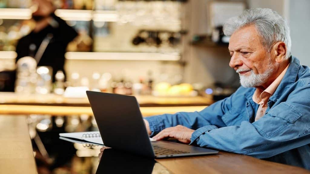 An older man studying