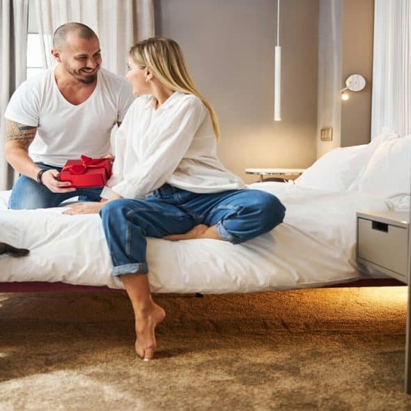 A man giving his wife a gift