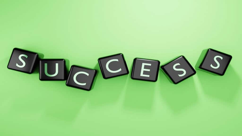 Cubes spelling out “success”