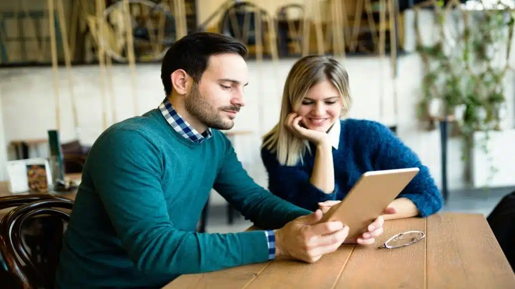 A couple looking at a menu
