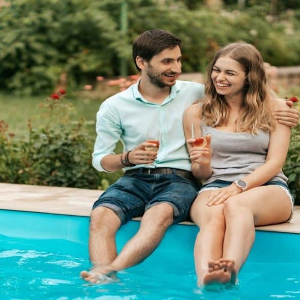 A couple wading in the pool