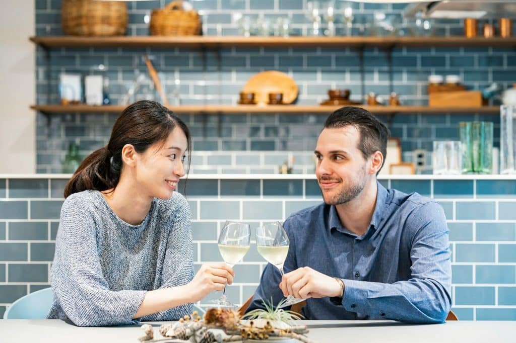 A man and woman smiling at each other
