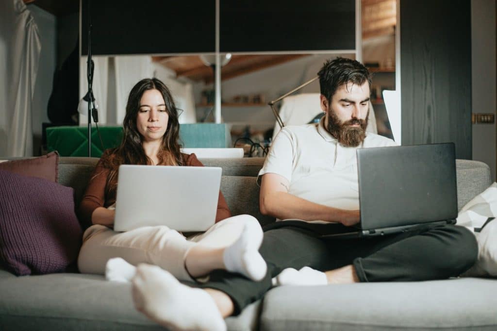 A man and woman working at home
