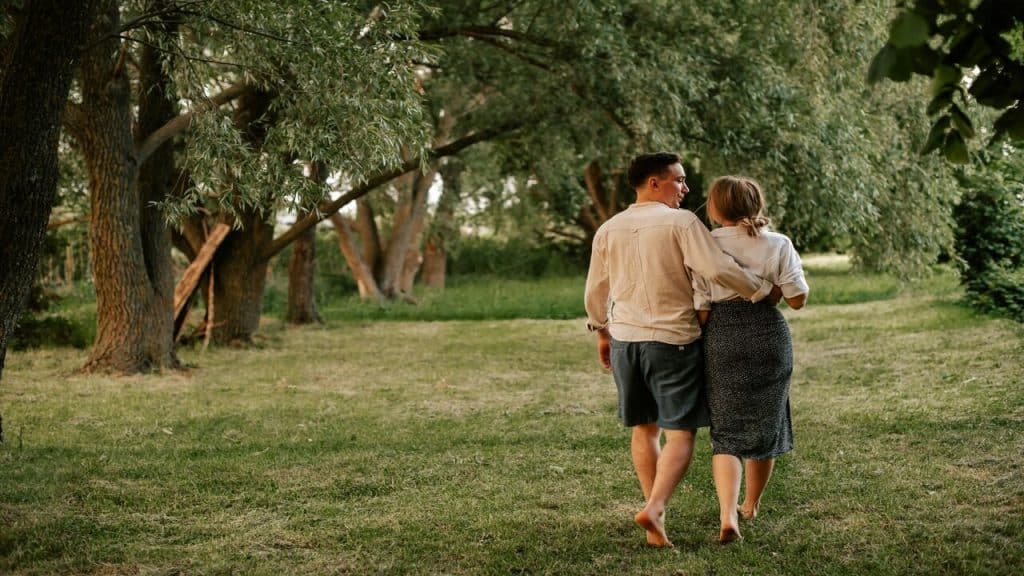 A couple walking through a private garden
