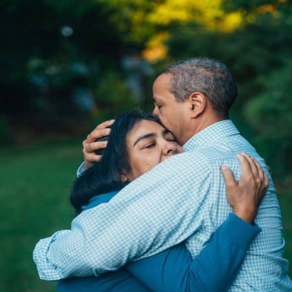 A woman comforting her husband