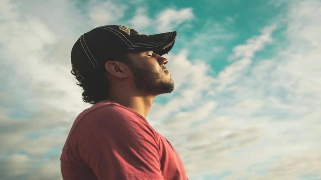 A man taking a deep breath