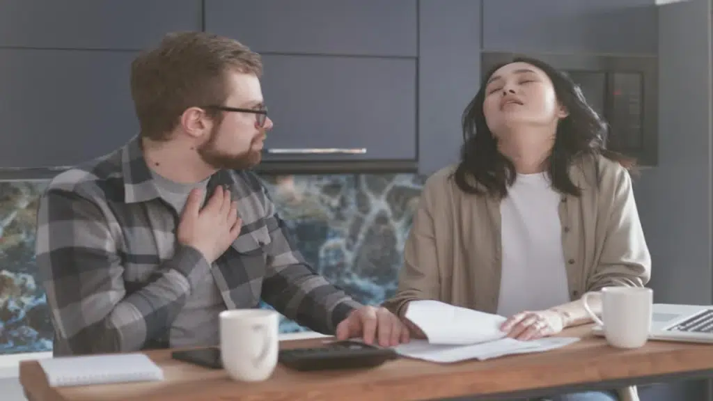 A couple looking stressed doing the bills