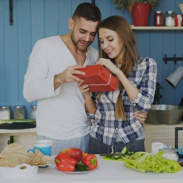 A man giving his wife a gift