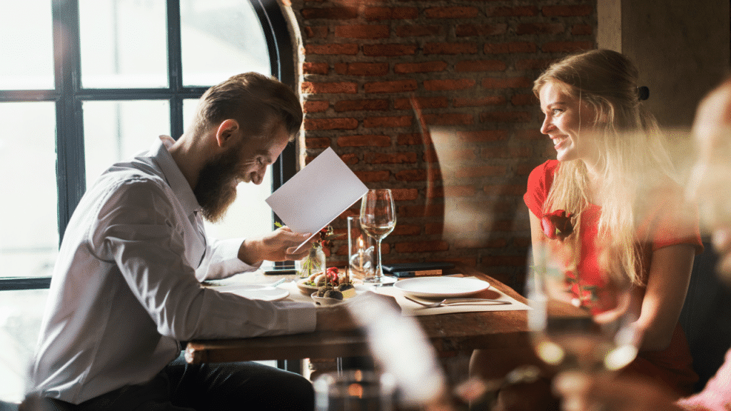 A couple looking at a menu