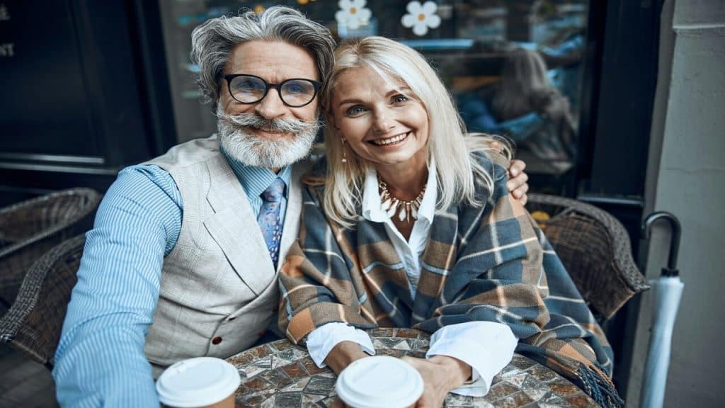 A beautiful mature couple having coffee together