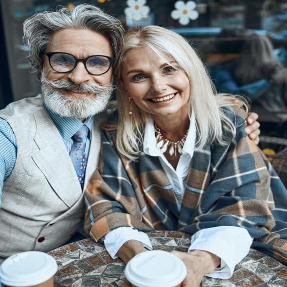 A beautiful mature couple having coffee together