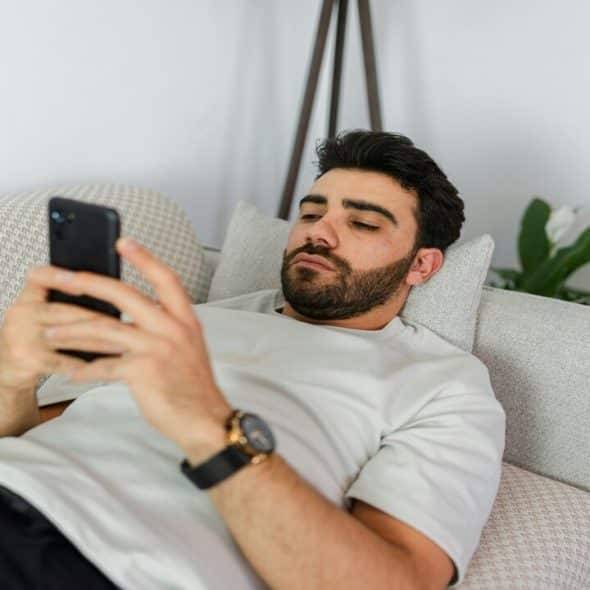 A man waiting for a text