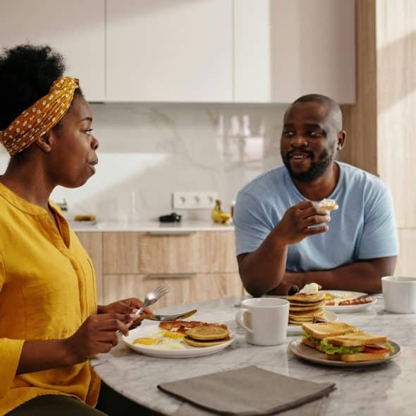 A man and woman having a breakfast together