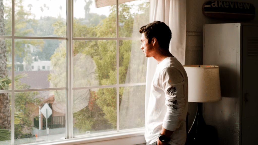 A man looking out the window