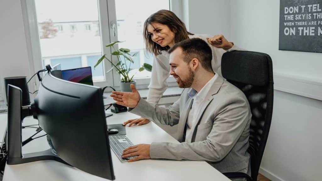 Colleagues looking at something on the computer 