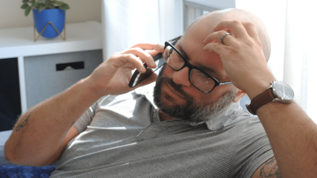 A man looking upset at home