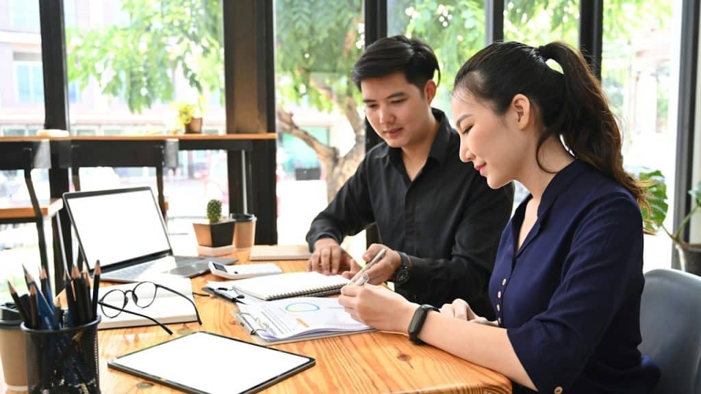 A couple working together on some paperwork.