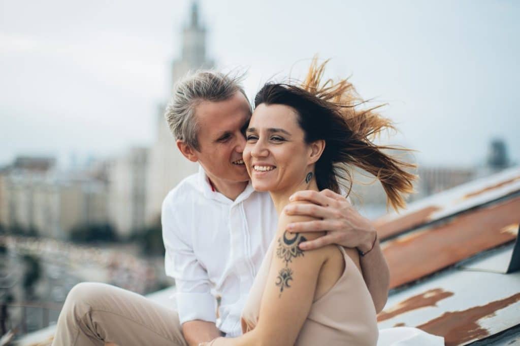 A man embracing a woman.
