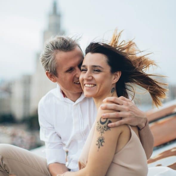 A man embracing a woman.