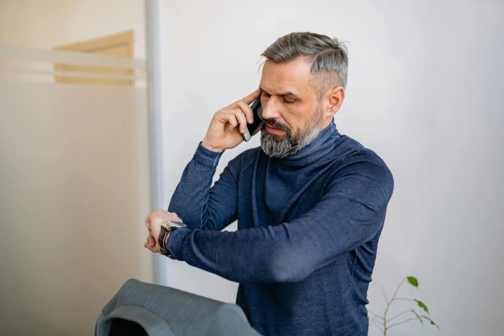 A man calling someone on the phone.