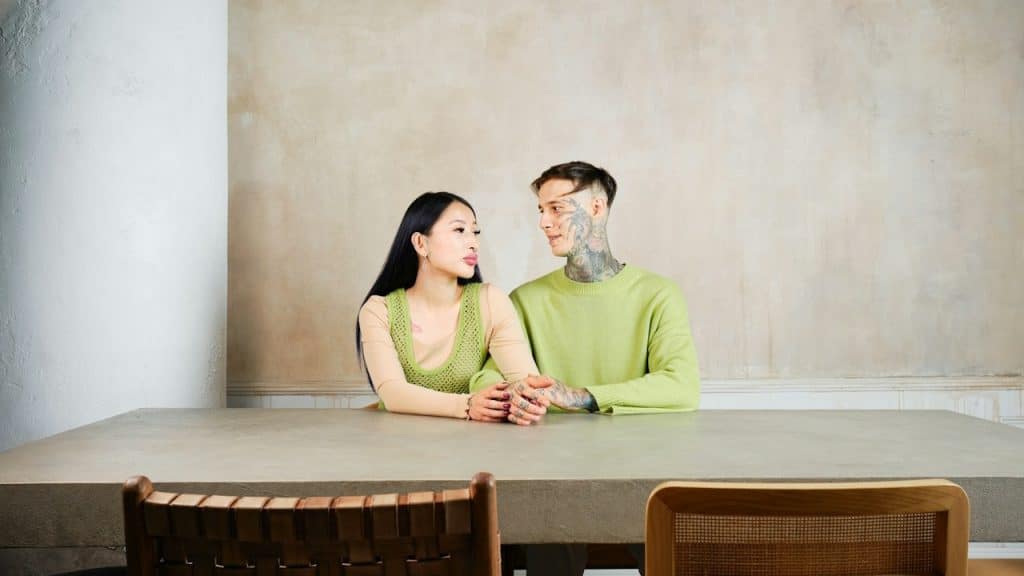 A man and a woman sitting at a table.