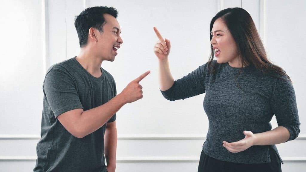 A man and a woman having an argument.
