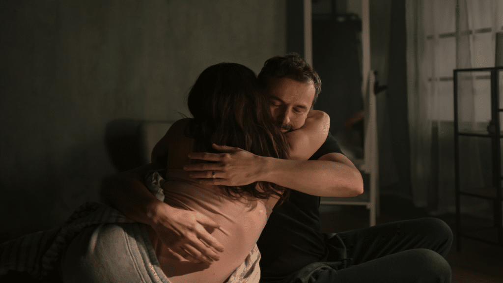 A couple giving each other a hug