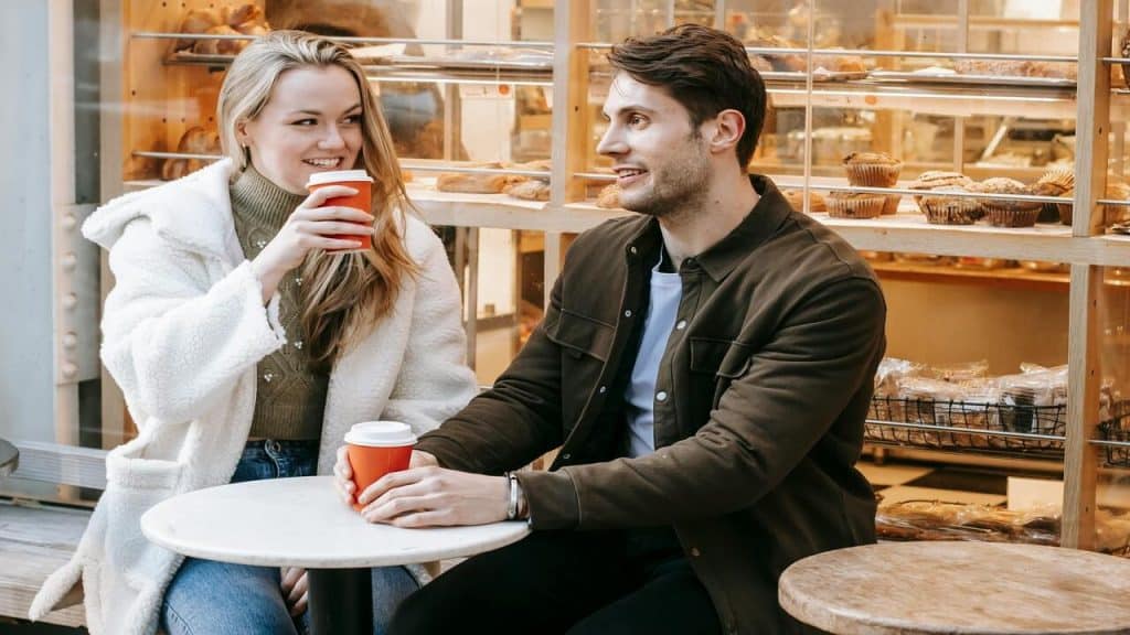 A couple talking over coffee 