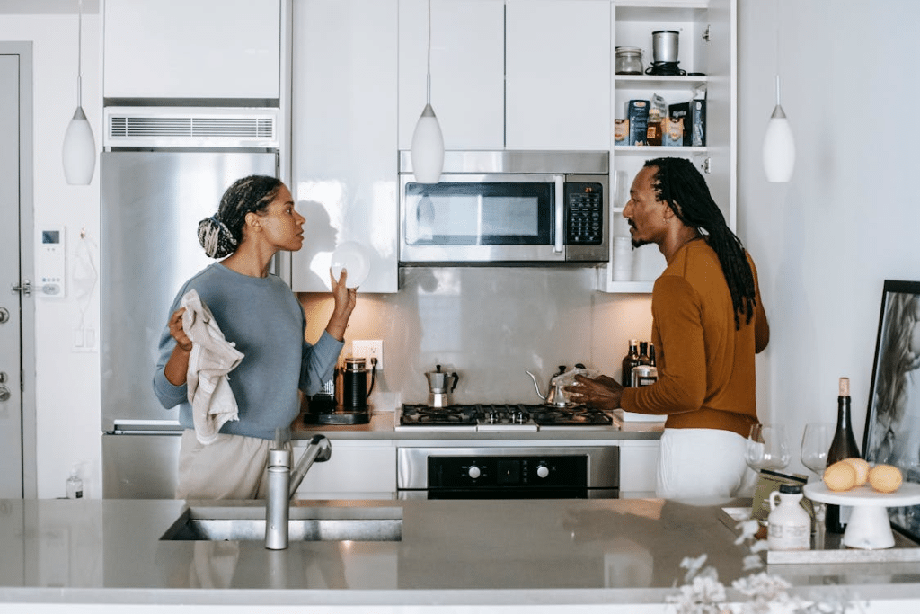 A couple arguing in the kitchen