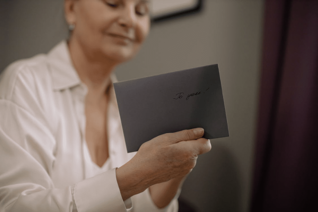 A woman holding an envelope