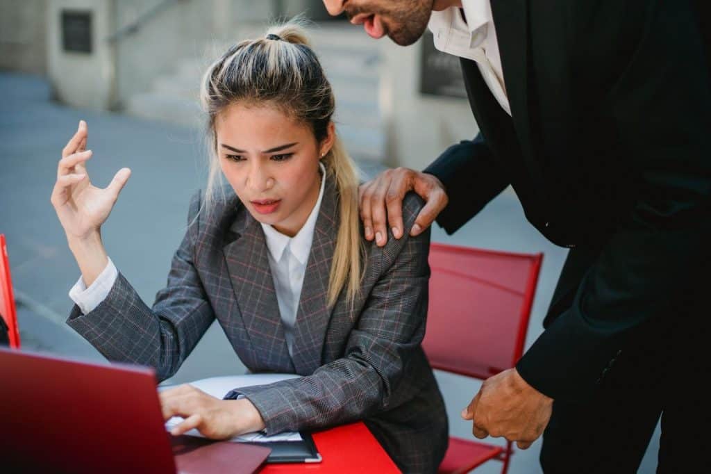 A man criticizing a woman’s work
