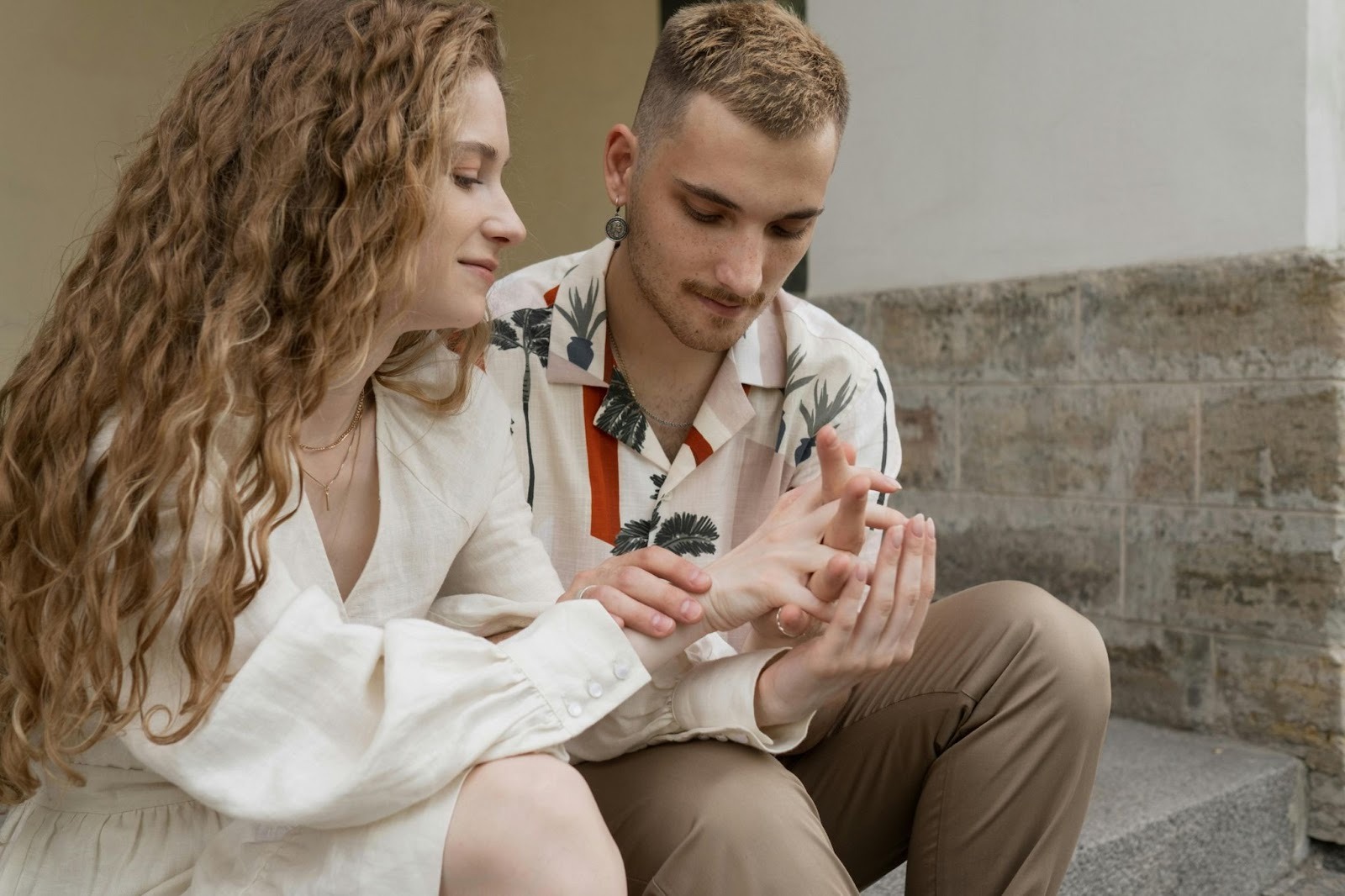 A man holding a woman’s hand 