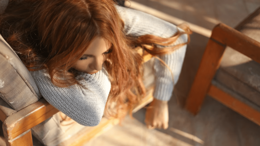 A woman looking tired at home