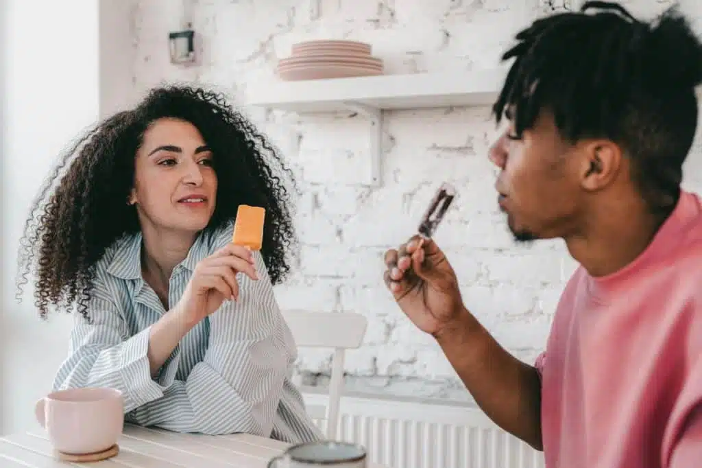 A man and woman eating ice cream together
