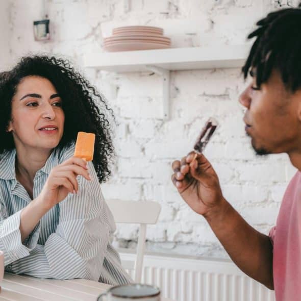 A man and woman eating ice cream together