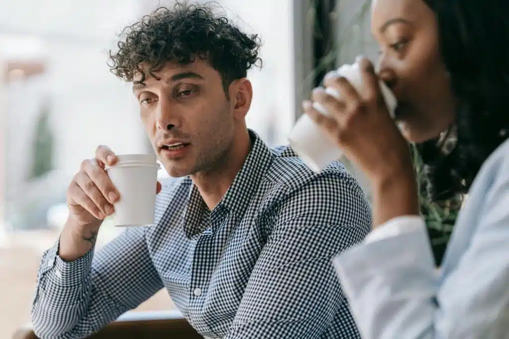 A man saying something to a woman