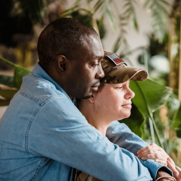 A man hugging a woman from behind