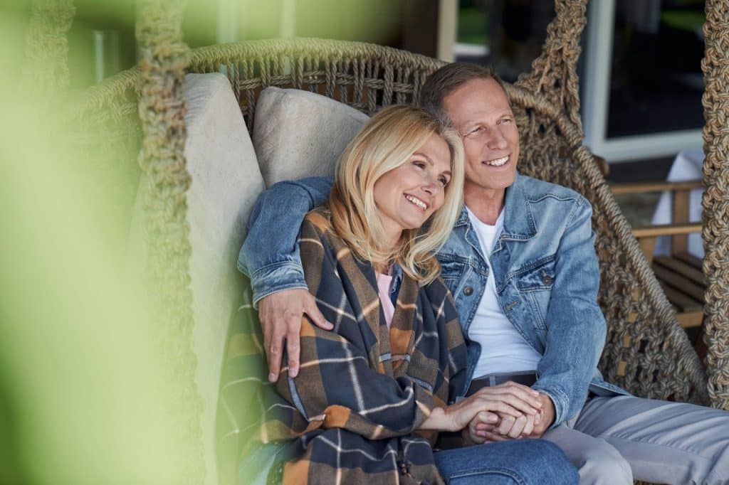 A man and woman smiling