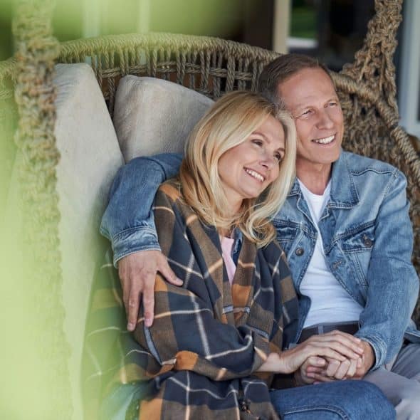 A man and woman smiling