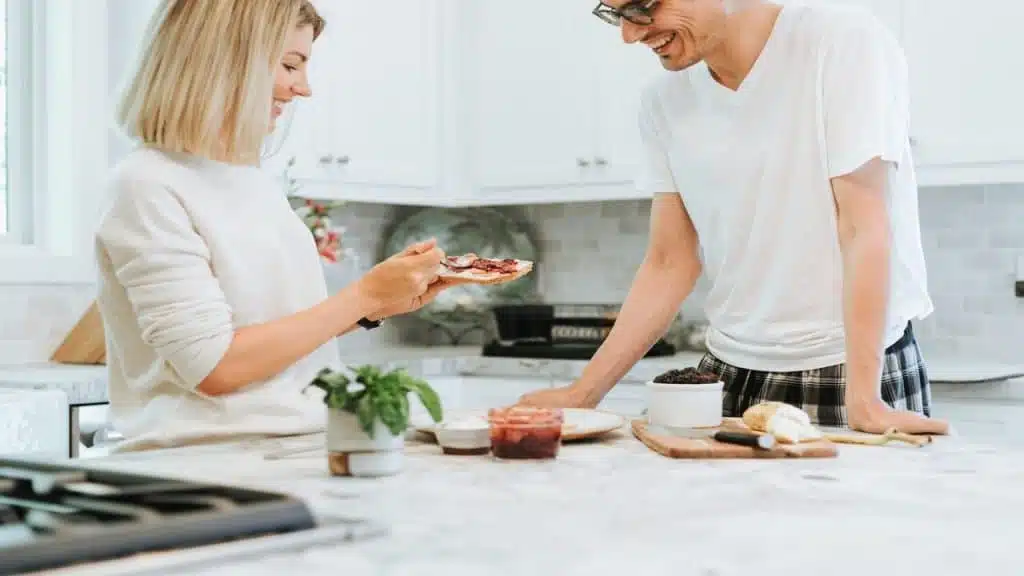 A woman making her husband a toast
