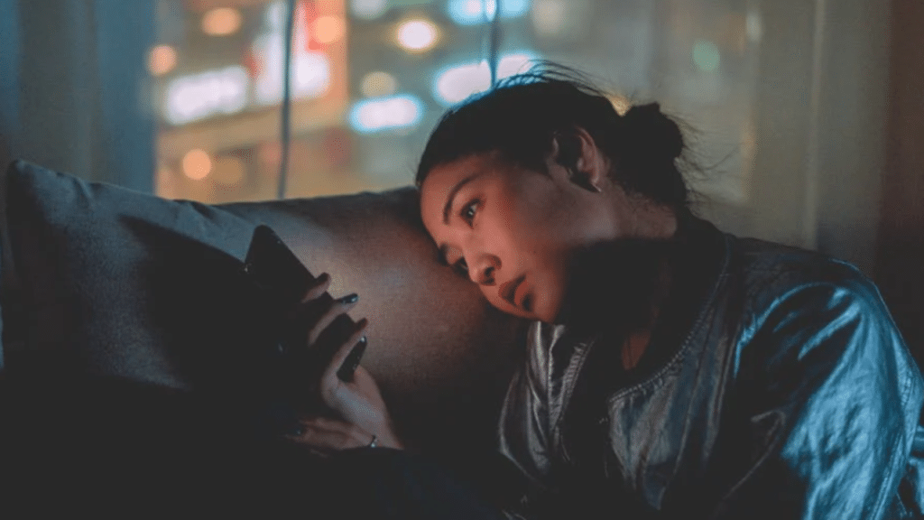 A woman waiting for a text 