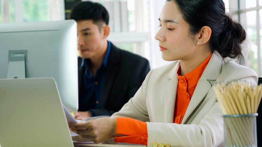 A man and woman not talking because of work