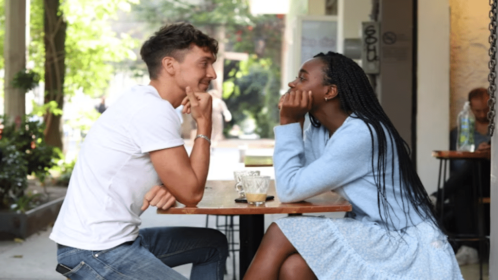 A couple mirroring each other on a date