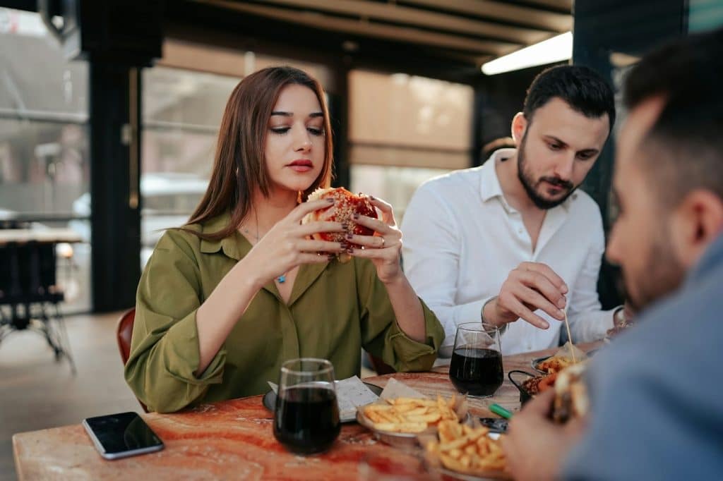 A man and woman at the restaurant but not having a good time 
