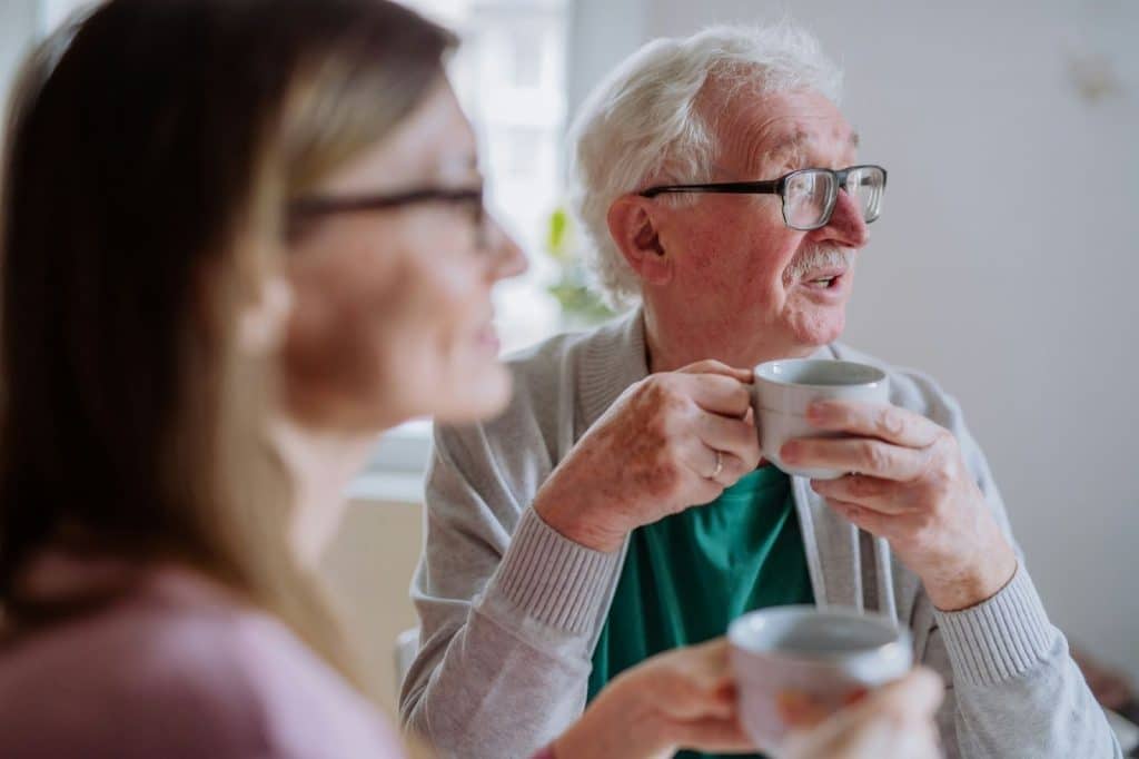 A man talking and a woman listening