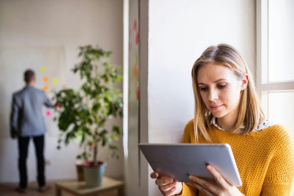 A woman checking her work 