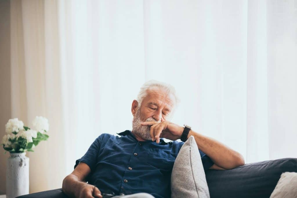A man sitting at the couch